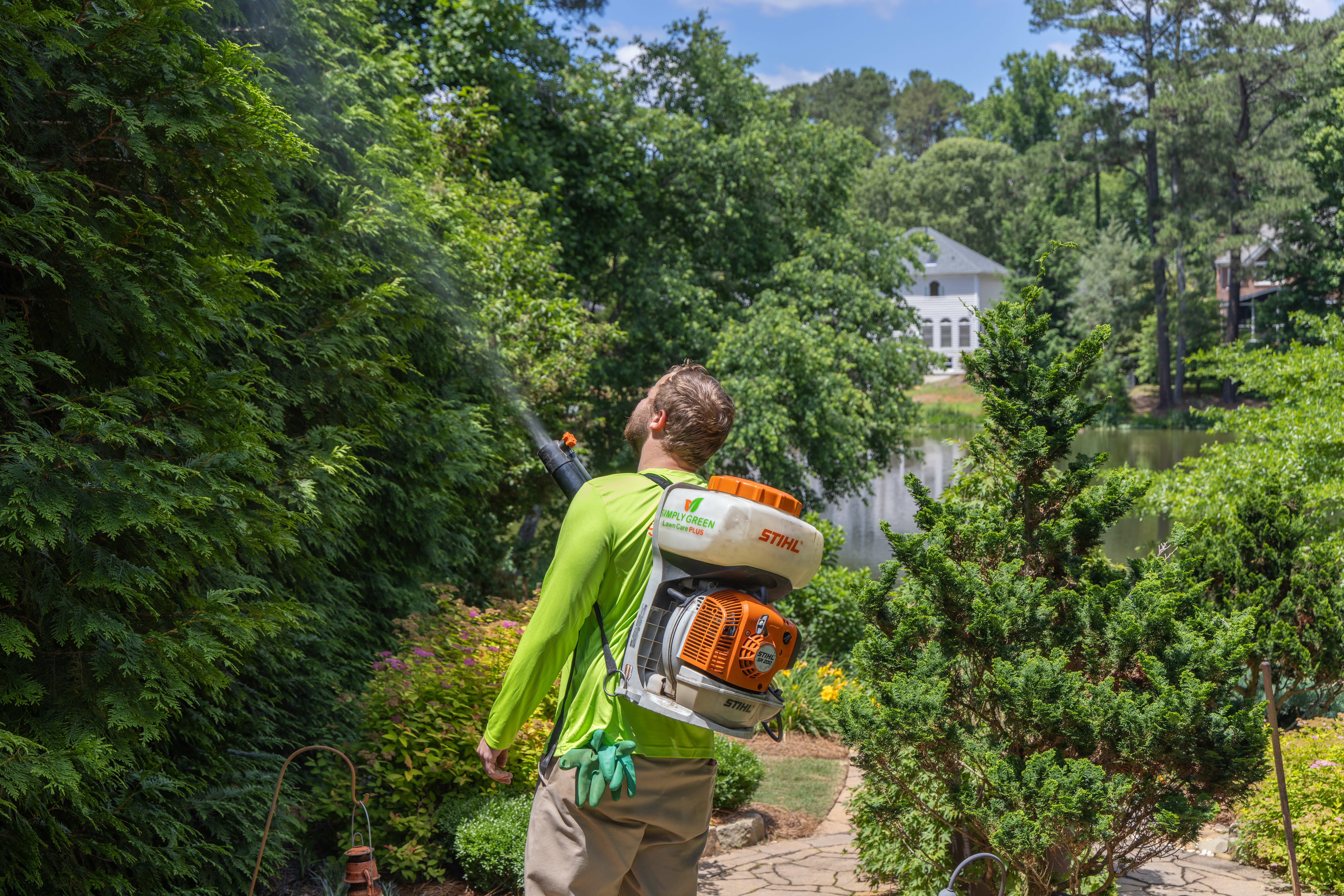 Simply Green Lawn Care Technician Using Mosquito Fogger Simply Green Lawn Care Technician Using Mosquito Fogger